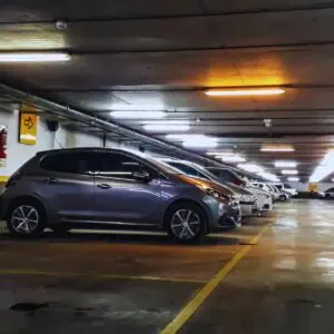 Line markings in a clean, well-lit underground parking lot in California, showing clear boundaries for improved vehicle organization and ADA compliance