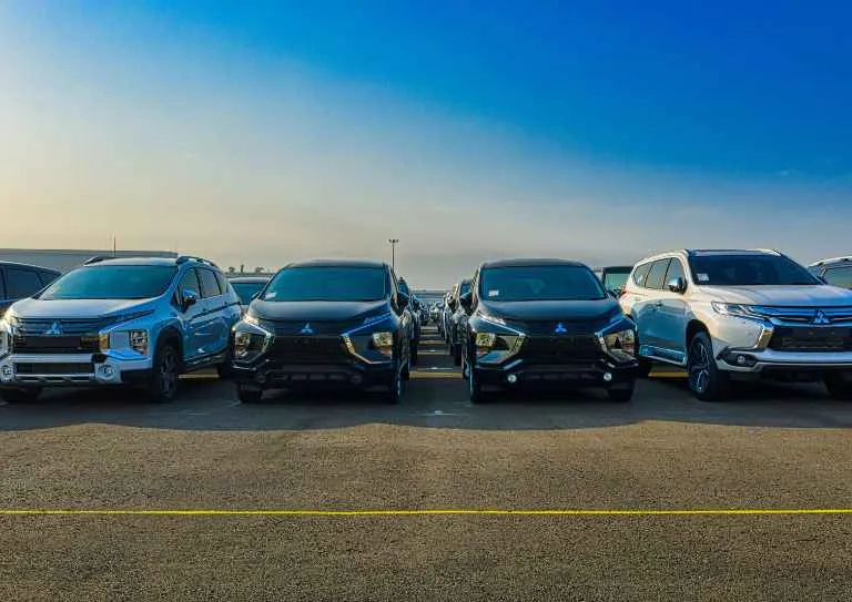 ows of vehicles in a commercial parking lot illustrating parking space allocation for California zoning and ADA ratio compliance