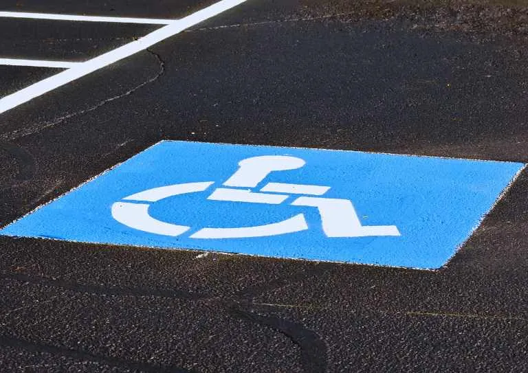 nternational accessibility symbol on ADA-compliant parking space in California