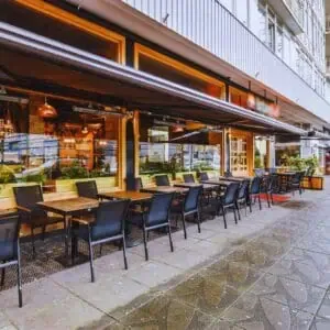 California restaurant with accessible entrance and outdoor dining area showing compliance with ADA parking and access standards